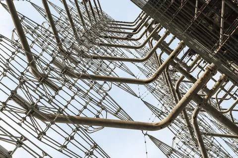Abstract pattern huge high army military radar against the blue sky in Chernobyl Foto stock