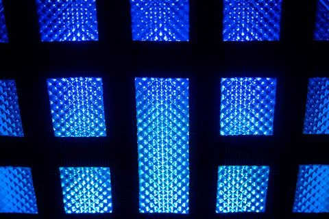 Abstract pattern of illuminated blue LED panels Foto stock