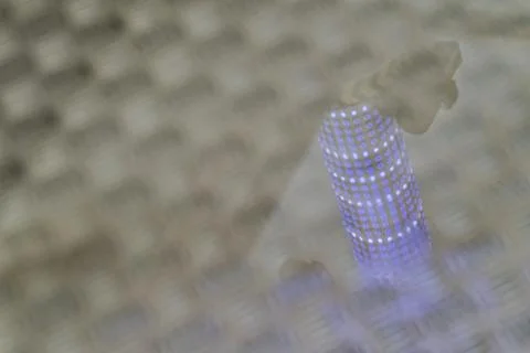 Abstract pattern of light reflections on textured surface with blue glowing.. Stock Photos