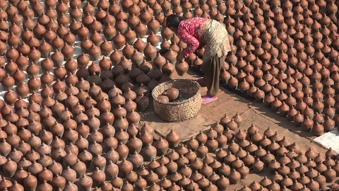 Abstract pattern, local woman drying ceramic pots in Nepal Video stock 85857354