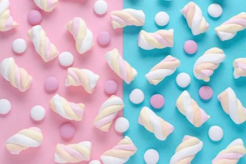 Abstract pattern with marshmallow and candys on pink and blue background Stock Photos