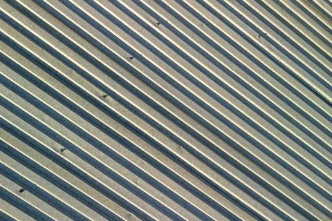 Abstract pattern of metal panels with lines creating a dynamic and modern design Stock Photos