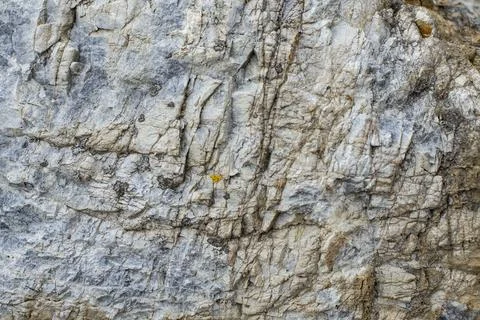 Abstract pattern of a mountain boulder, rock wall texture ,with blue shades.. Stock Photos