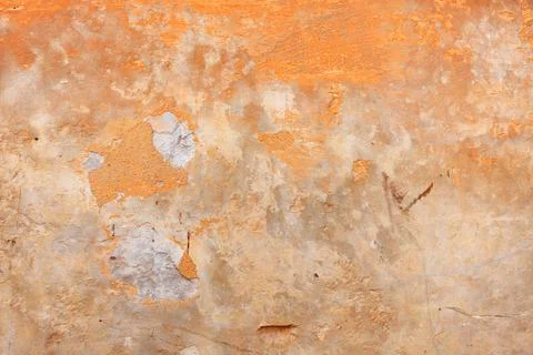 Abstract pattern on an old wall with the texture of old peeling plaster. Stock Photos