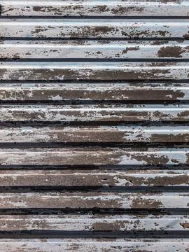 Abstract pattern of peeling paint on surface of corrugated steel sheet 스톡 사진