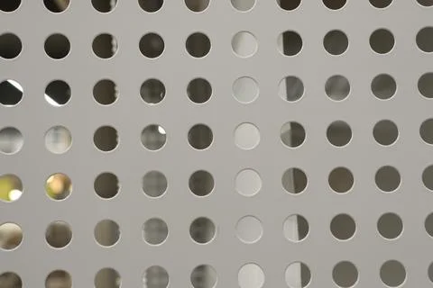 An Abstract Pattern of a Perforated Metal Sheet in Design and Architecture Stock-Fotos