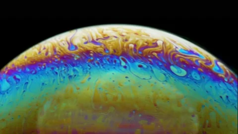 Abstract pattern, rainbow chaotic texture inside of the soap bubble, closeup. Stock Footage 165633597