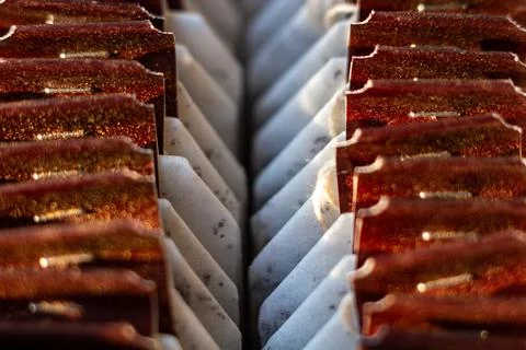 Abstract pattern of red metallic elements and white textured surfaces 写真素材