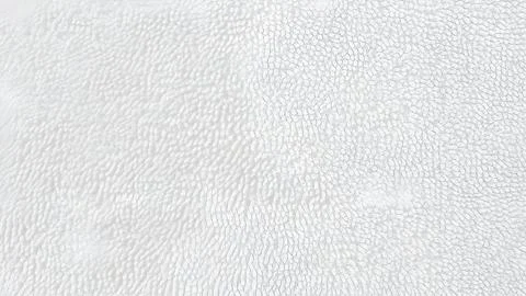 Abstract pattern with scattered small white squares on a light grey backgroun Fotos de archivo