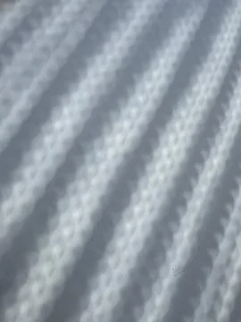 Abstract pattern of shadows and light created during a partial solar eclipse Stock Photos