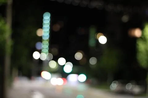 Abstract pattern of shining lights with bokeh effect on a dark background Stock Photos