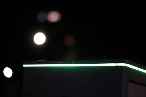 Abstract pattern of shining lights with bokeh effect on a dark background 写真素材