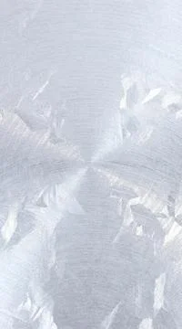 Abstract pattern of shiny metal with a circular brushed finish, creating a .. Stock Illustration