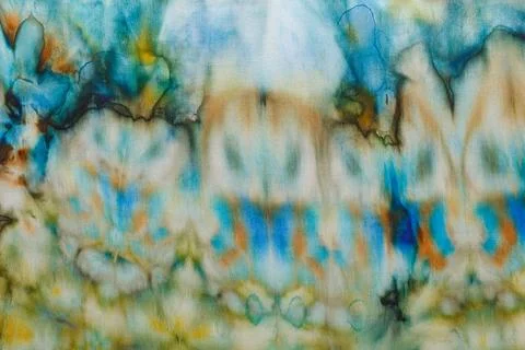 Abstract pattern on silk fabric texture in blue, yellow, green colors Stock Photos