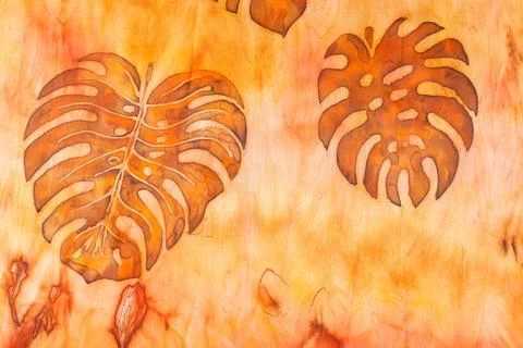 Abstract pattern on silk fabric texture in yellow and brown tones Stock Photos