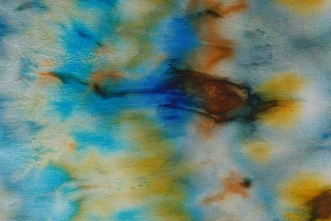 Abstract pattern on silk fabric texture in blue, yellow, green colors Stock Photos