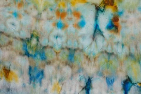 Abstract pattern on silk fabric texture in blue, yellow, green colors Stock Photos