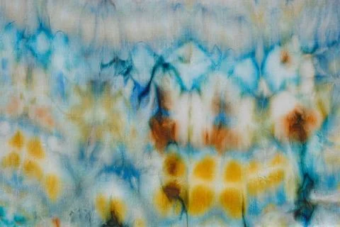 Abstract pattern on silk fabric texture in blue, yellow, green colors Stock Photos