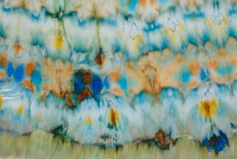 Abstract pattern on silk fabric texture in blue, yellow, green colors Stock Photos