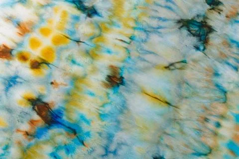 Abstract pattern on silk fabric texture in blue, yellow, green colors Stock Photos