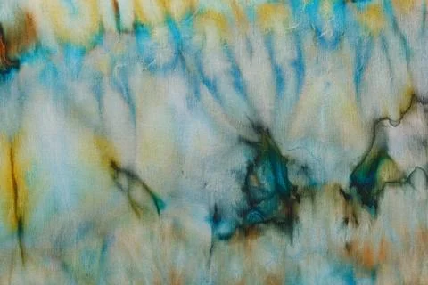 Abstract pattern on silk fabric texture in blue, yellow, green colors Stock Photos