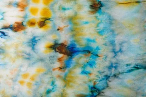 Abstract pattern on silk fabric texture in blue, yellow, green colors Stock Photos