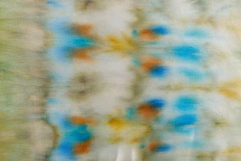 Abstract pattern on silk fabric texture in blue, yellow, green colors Stock Photos