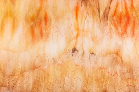 Abstract pattern on silk fabric texture in yellow and brown tones Stock Photos