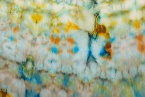 Abstract pattern on silk fabric texture in blue, yellow, green colors Stock Photos