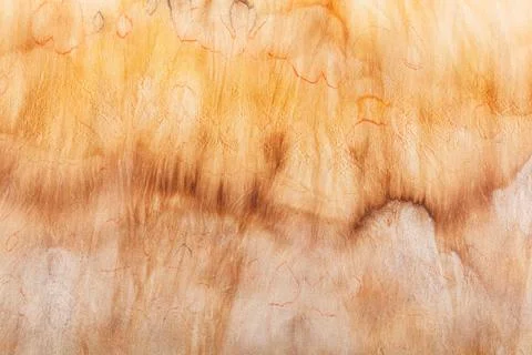Abstract pattern on silk fabric texture in yellow and brown tones Stock Photos