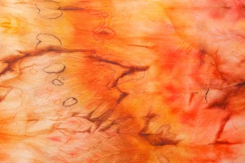 Abstract pattern on silk fabric texture in yellow and brown tones Stock Photos