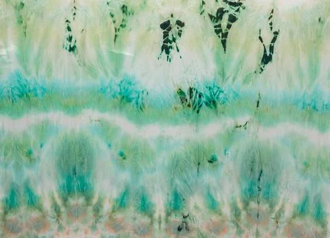 Abstract pattern on silk fabric texture in green tones Stock Photos