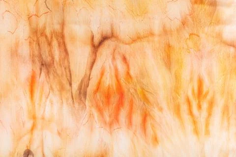 Abstract pattern on silk fabric texture in yellow and brown tones Stock Photos