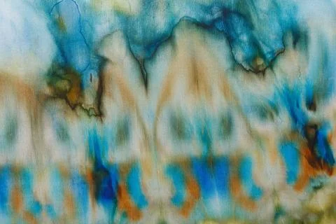 Abstract pattern on silk fabric texture in blue, yellow, green colors Stock Photos