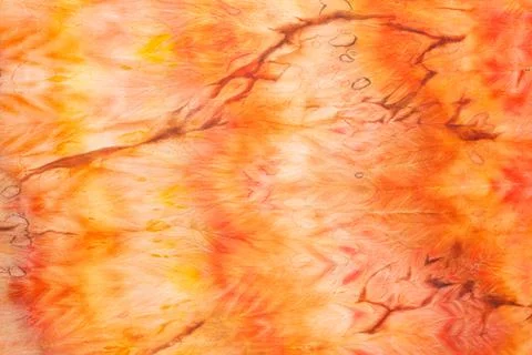 Abstract pattern on silk fabric texture in yellow and brown tones Stock Photos