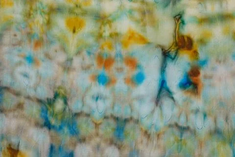 Abstract pattern on silk fabric texture in blue, yellow, green colors Stock Photos