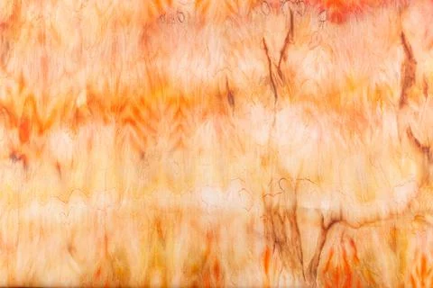 Abstract pattern on silk fabric texture in yellow and brown tones Stock Photos