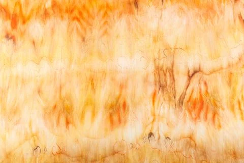 Abstract pattern on silk fabric texture in yellow and brown tones Stock Photos