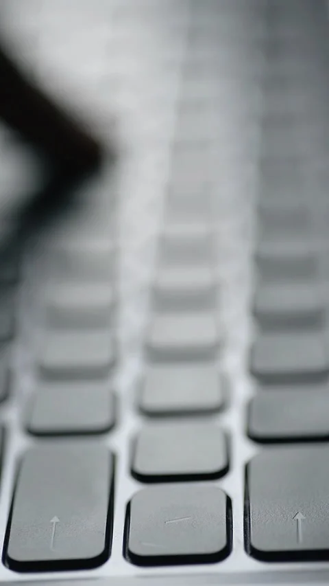 Abstract pattern of silver laptop keys, Vertical video Stock Footage 325705167