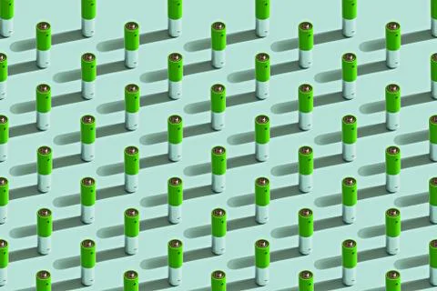 Abstract pattern of small green batteries on blue background Stock Photos