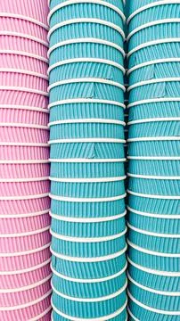 Abstract pattern of stacked pink and blue ripple paper cups for takeaway coff Stock Photos