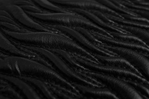 Abstract pattern with stitches on black leather, ornamental flame  shapes o.. Stock Photos
