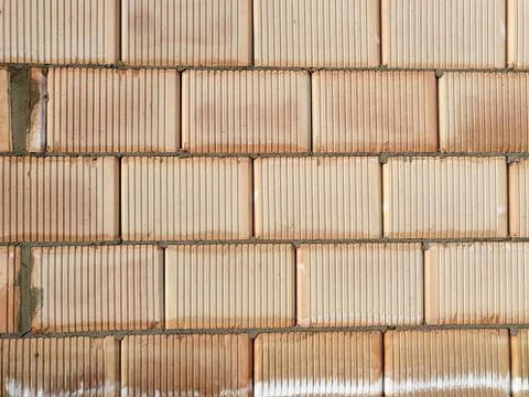 Abstract pattern of unfinished ceramic block wall Stock Photos