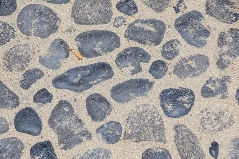 The abstract pattern of wall constructed with pebbles Stock Photos