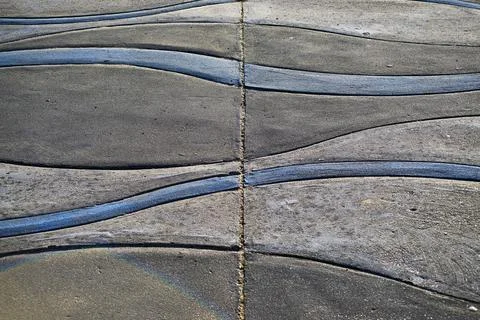 An abstract pattern of wavy lines on concrete Stock Photos