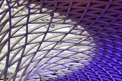 An abstract pattern of white and purple metal pipes. Stock Photos