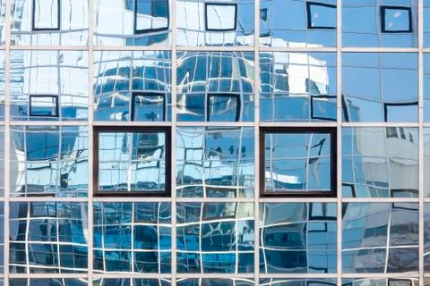 Abstract patterns and reflections in windows of modern office buildings Stock Photos