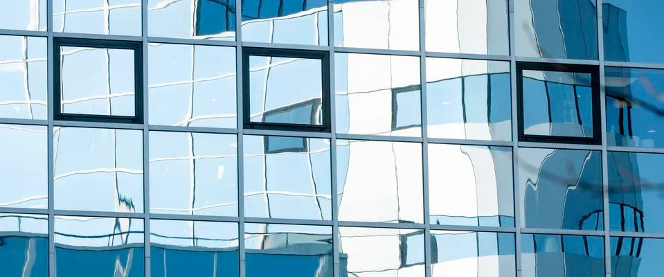 Abstract patterns and reflections in windows of modern office buildings Fotos de archivo