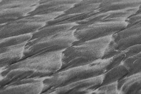 Abstract patterns on famous black sand of New Zealand beaches. Fotos de archivo