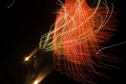 Abstract patterns of fireworks explosions at Christmas night Stock Photos